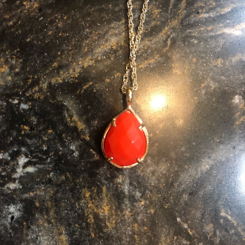 Kendra Scott red drop pendant.